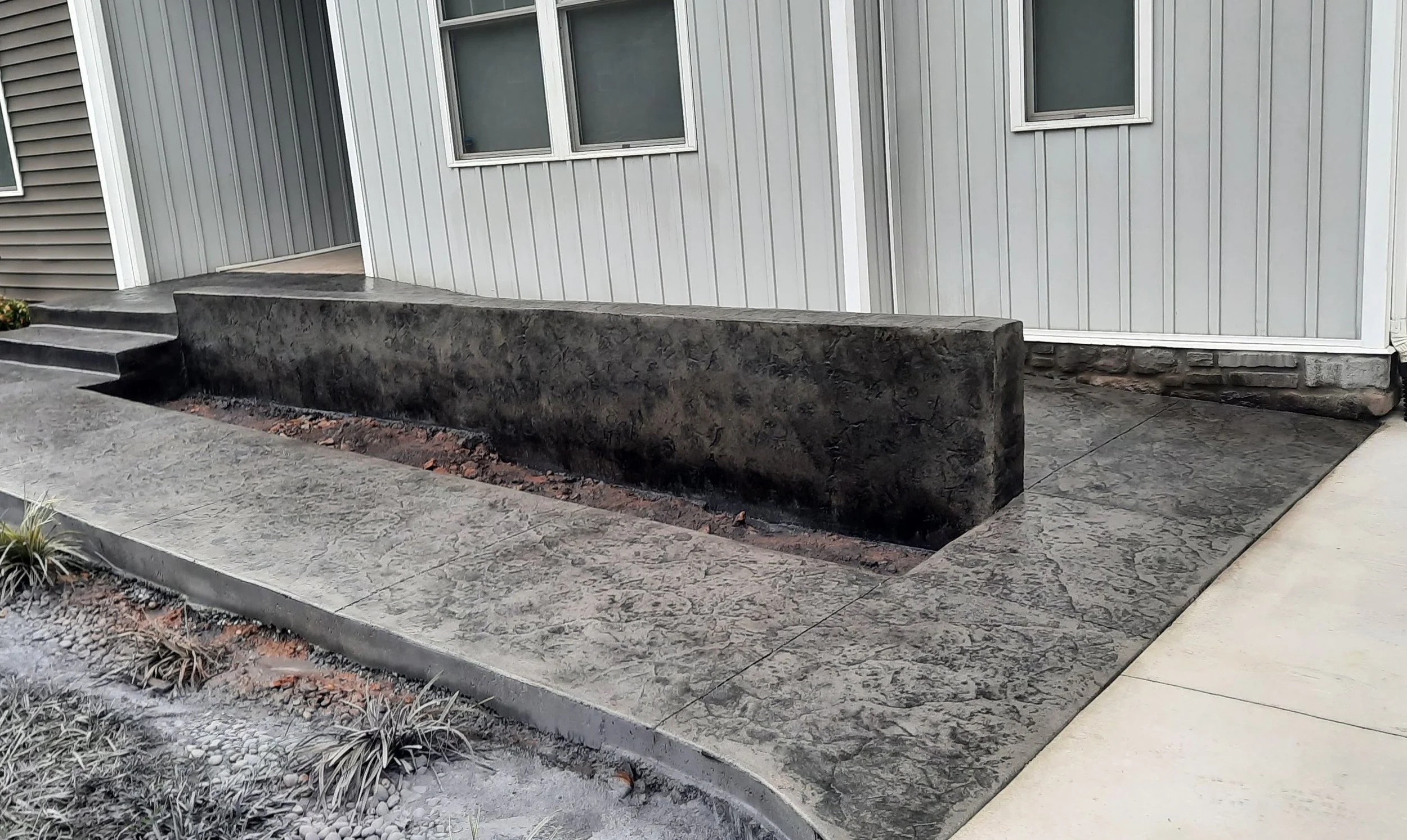 Decorative concrete sidewalk with steps