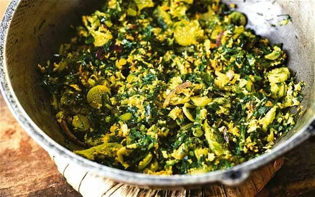 Shredded leafy greens with turmeric, mustard seed and coconut shavings