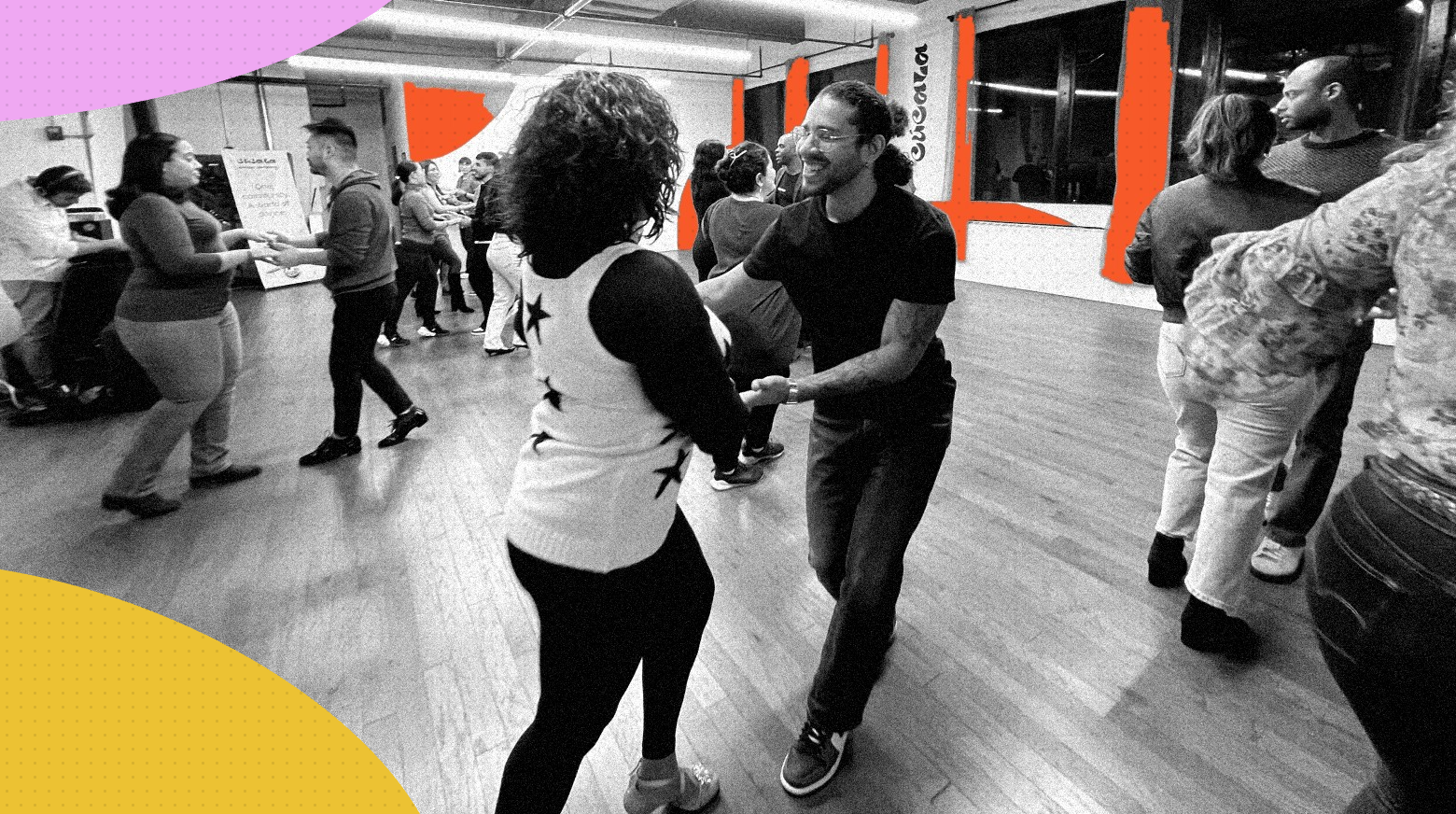 Couples dancing together at a social dance inside the Cucala Dance Company studio, with a smiling partner leading in the center, in black and white with orange, pink and yellow graphic accents