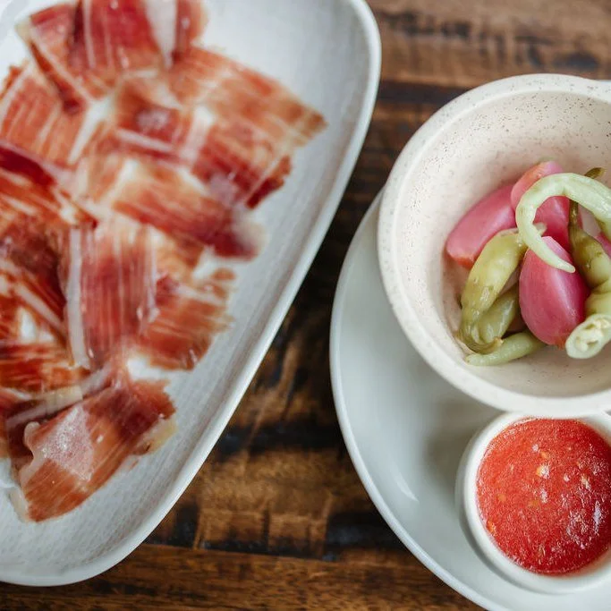From the oak forests of southern Spain to our kitchen in Albion - our Iberico pork is something special.

These heritage pigs roam freely, feeding on acorns, which gives their meat its melt-in-your-mouth texture and distinctive flavour.

Slow cooked,