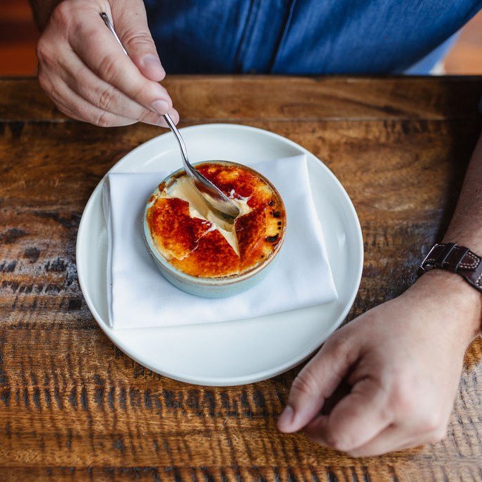 That first crack of caramelised sugar.

Then the cream - smooth, warm, and gently vanilla-scented.

A moment of contrast: crisp gives way to soft, bitterness melting into sweetness.
Simple. Indulgent. Effortlessly good.

#CremeBrulee #DessertMoment #