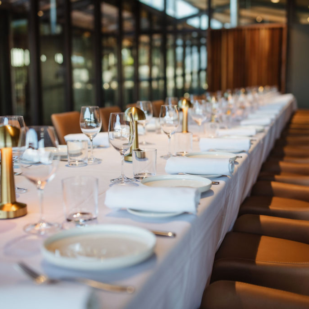 Group dining dishes served to table at Hervé’s Restaurant & Bar