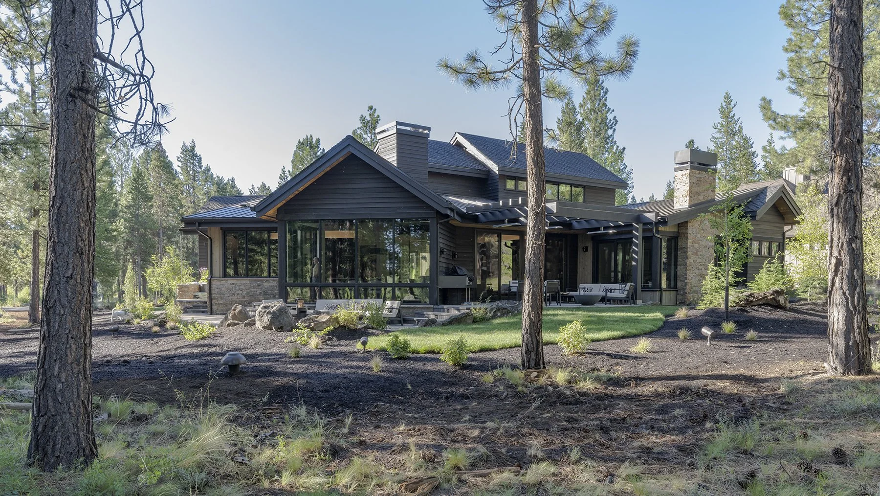 Back view of contemporary and modern home designed by Griffin Home Design for a couple in Caldera Springs.