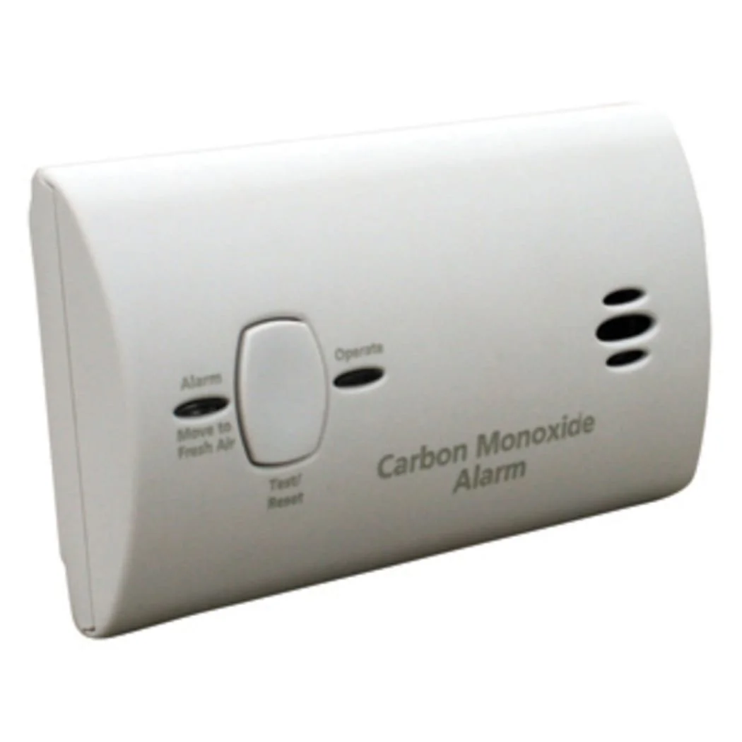Carbon monoxide alarm device with a test/reset button.