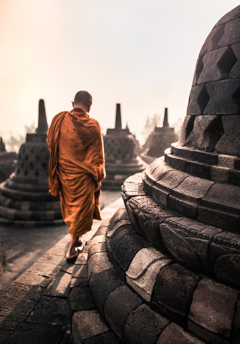 A monk walking around Borobudur Temple.jpg