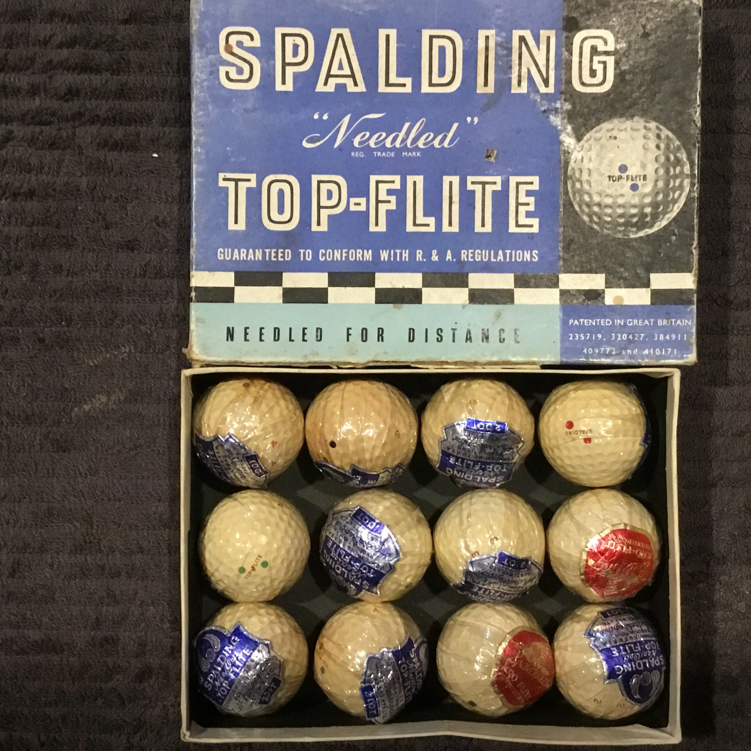 Dozen Boxed and individually wrapped Spalding Top Flight Needled Golf Balls