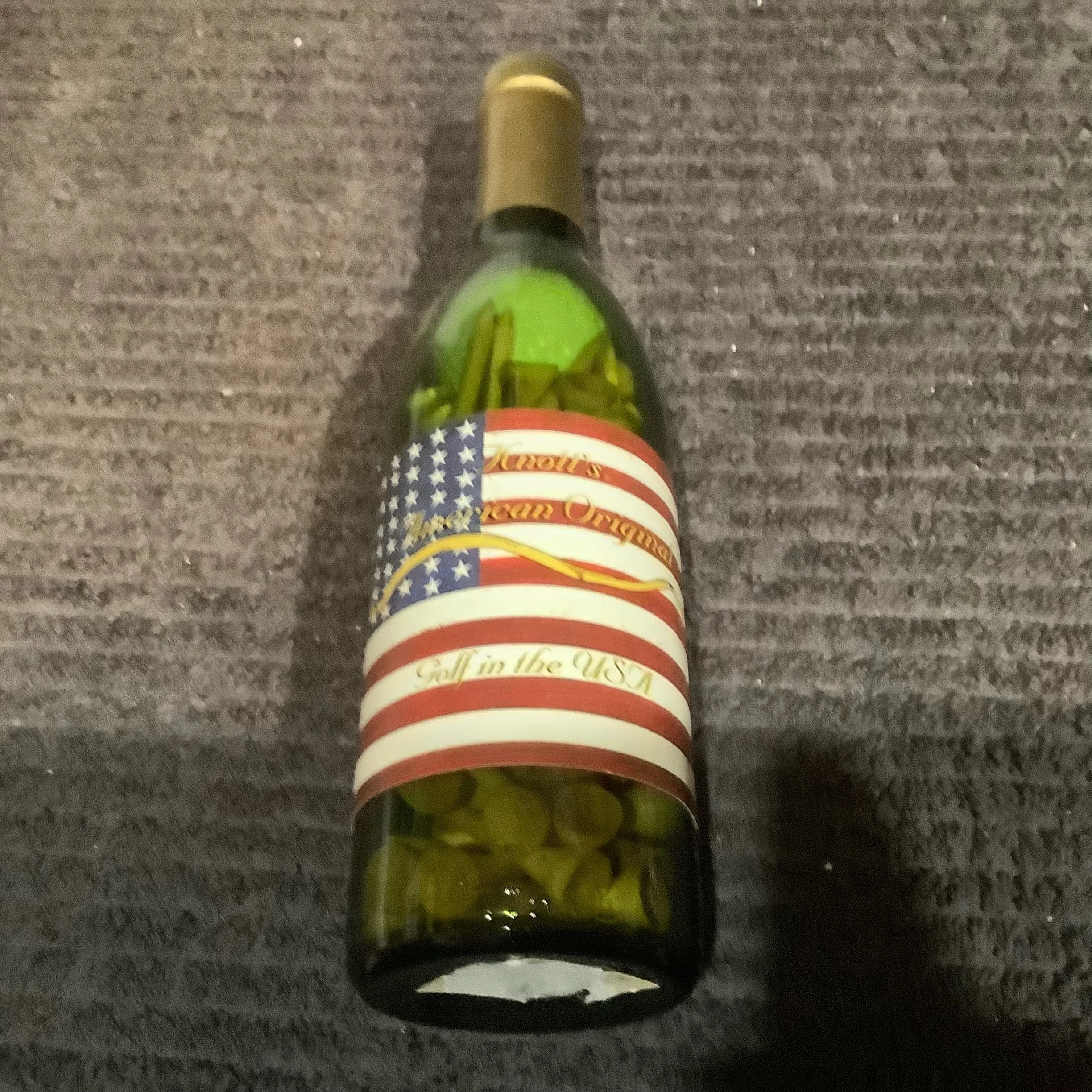 Knott’s American Original Promotion Bottle containing one golf ball and tees