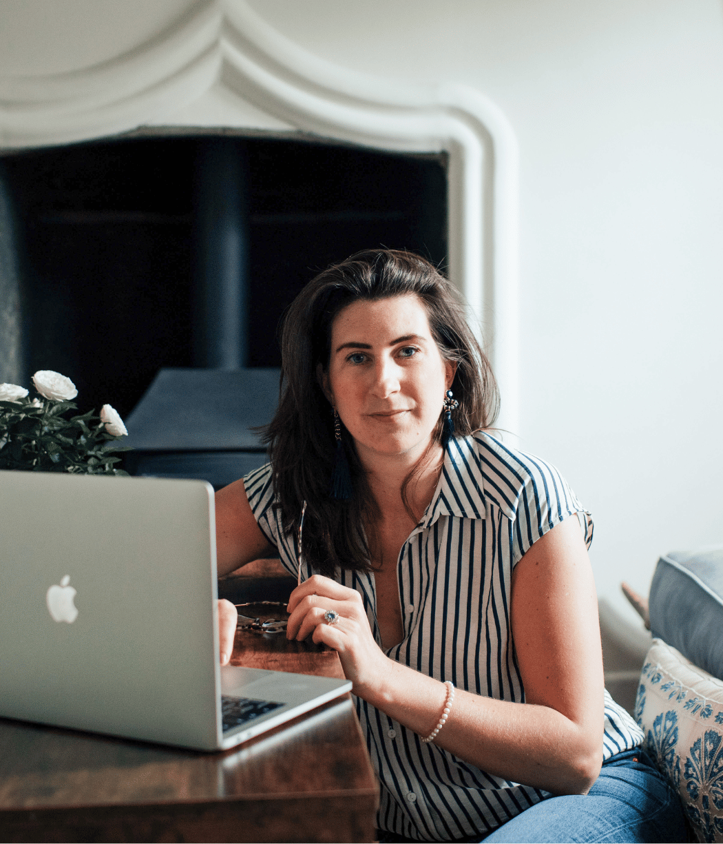 Josephine Brooks with Laptop on a wooden table