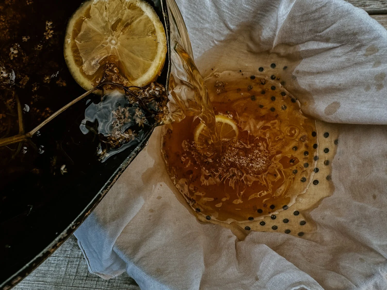 Elderflower Cordial being strained - Josephine Brooks.jpg