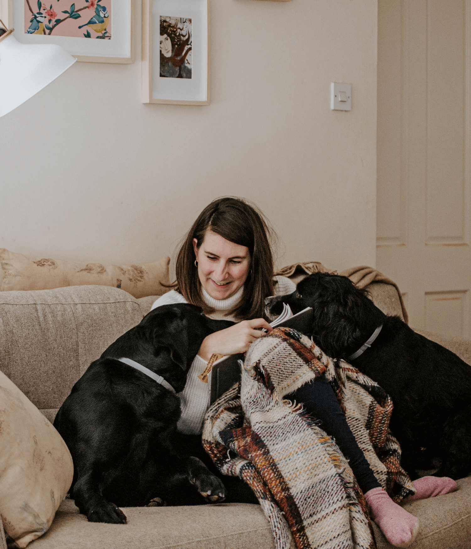 Josephine Brooks with her dogs on the sofa.png