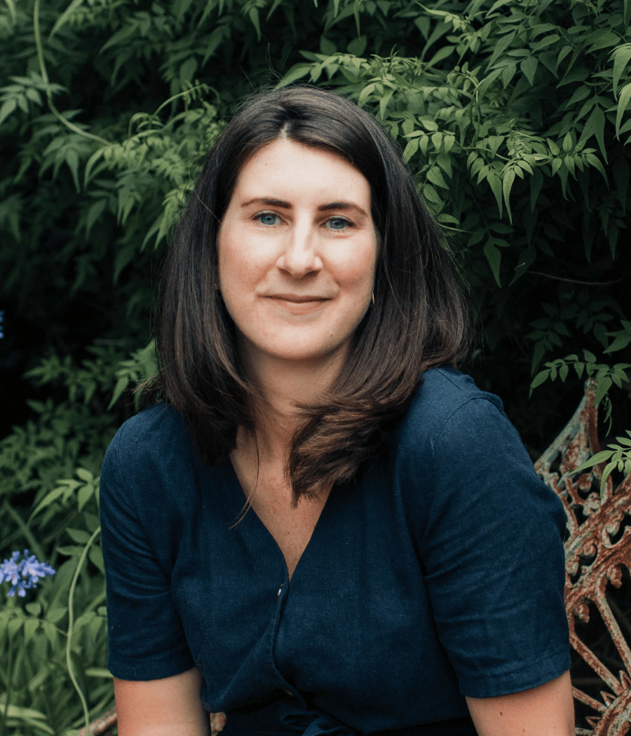 Josephine Brooks in a navy ddress.png