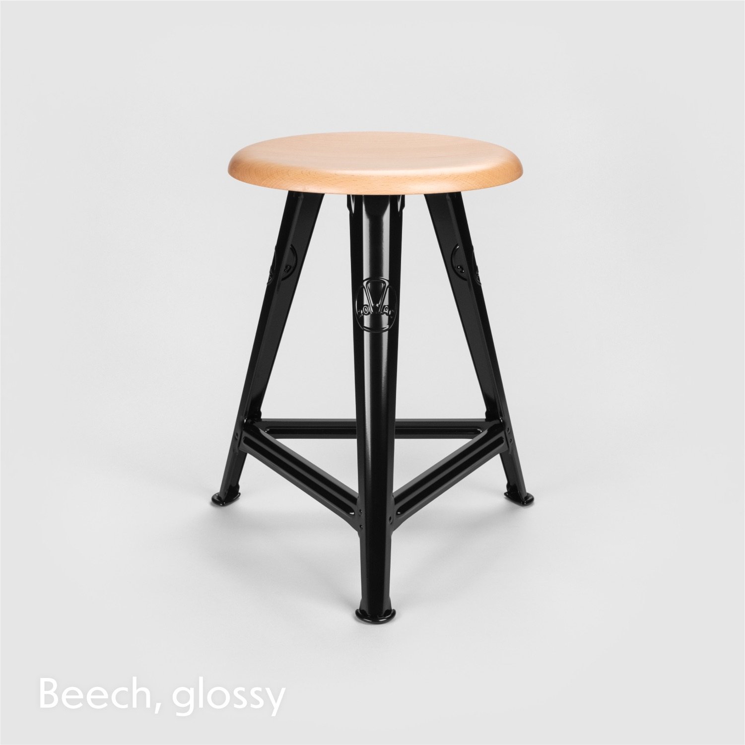 l Schemel or workshop stool with steel riveted construction and wooden seat top.