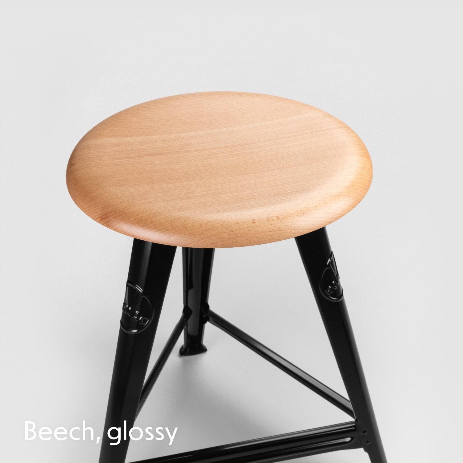 View from above at the solid wood seat top of the Rowac schemel or workshop stool.