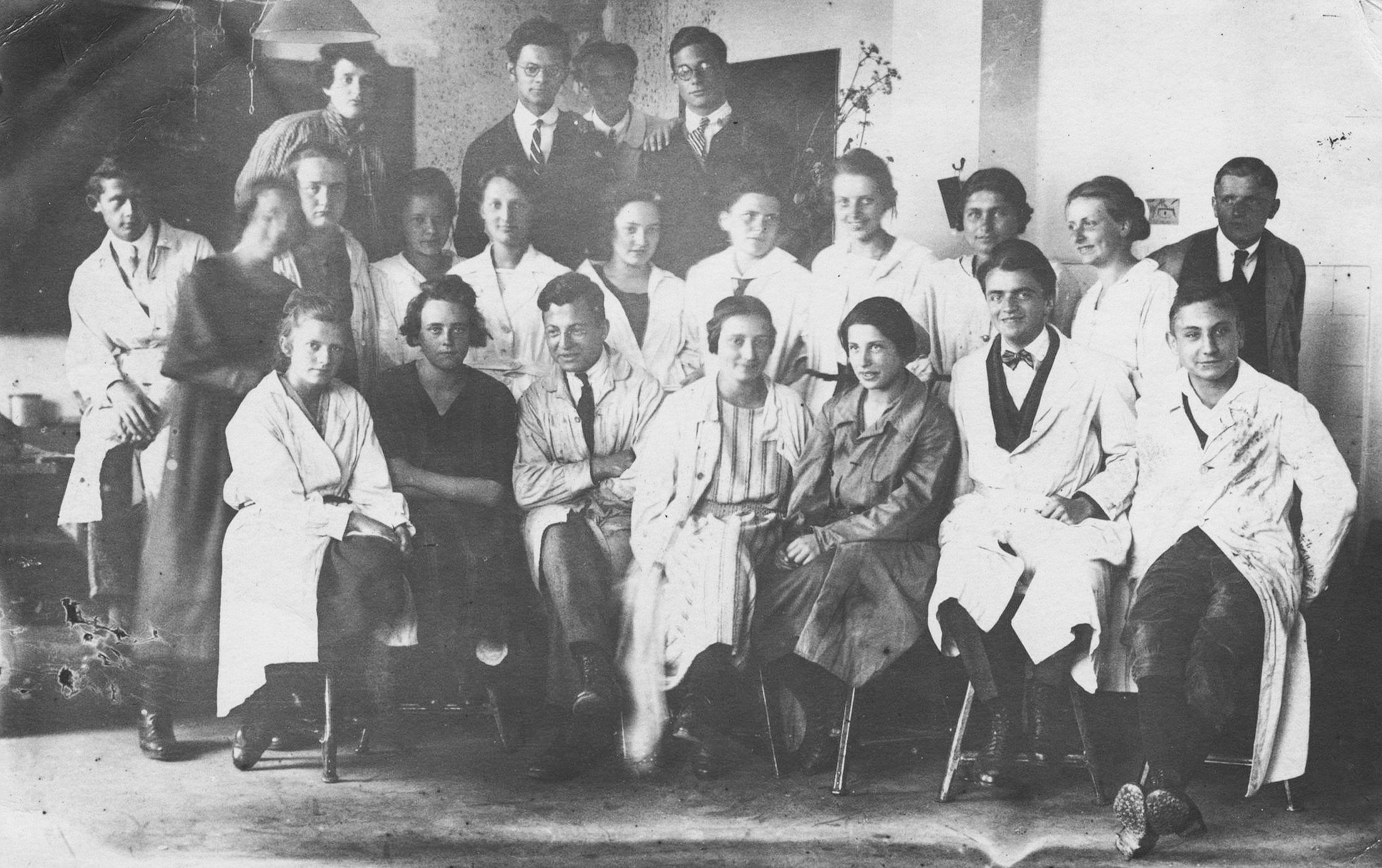 Bauhaus Weimar students and teachers or faculty sitting on Rowac schemel or stools in 1923.