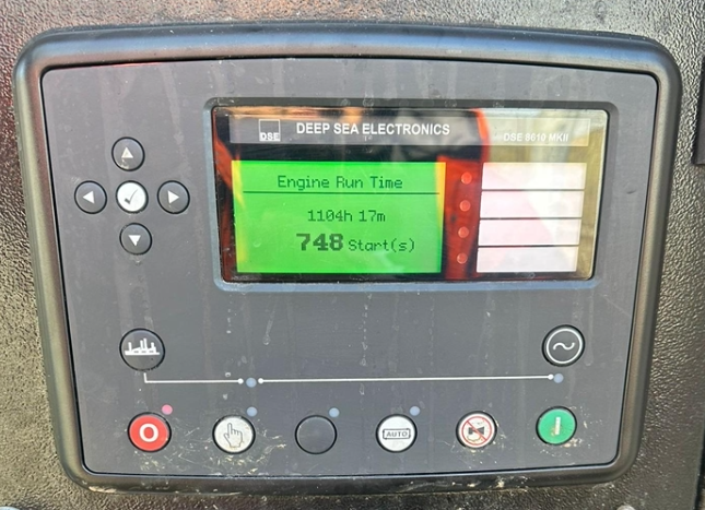 A marine engine control panel with a digital display showing engine run time of 1104 hours and 17 minutes, and 748 start attempts, labeled 'Deep Sea Electronics'.