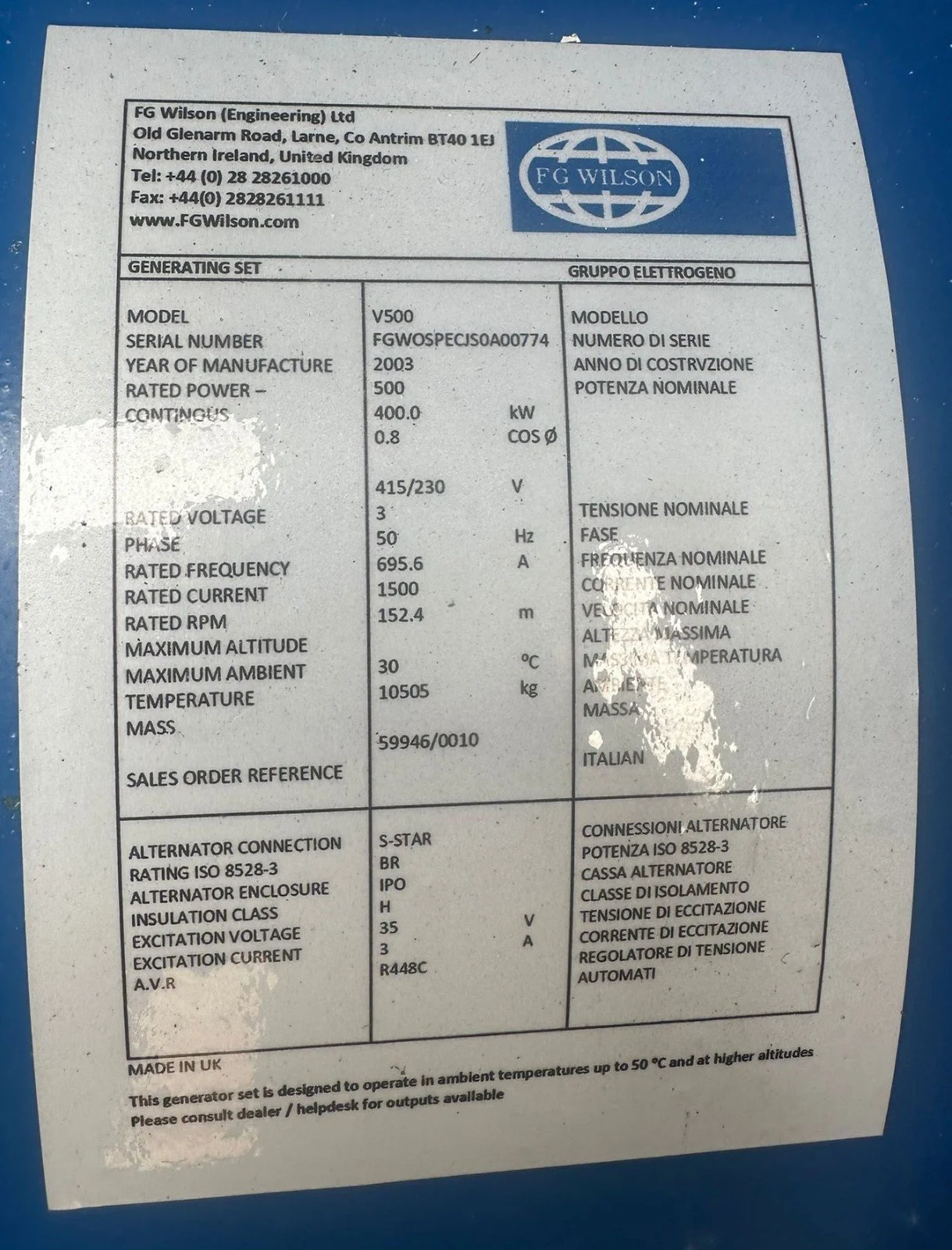 A technical data label for a generator, showing manufacturer information, model number, serial number, specifications, and electrical details. The label is from FG Wilson, stating the generator model as V500, rated power 500 kW, manufactured in 2003.