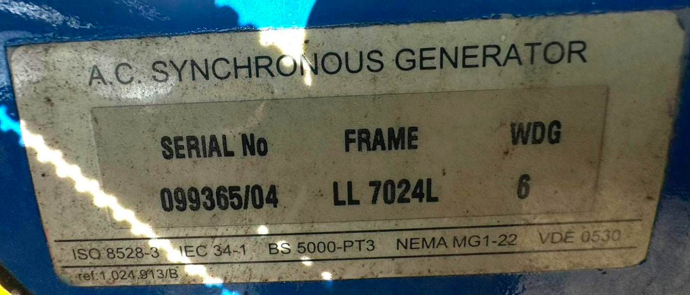 A label on an AC synchronous generator showing serial number 099365/04, frame LL 7024L, WDG 6, and various technical standards and codes.