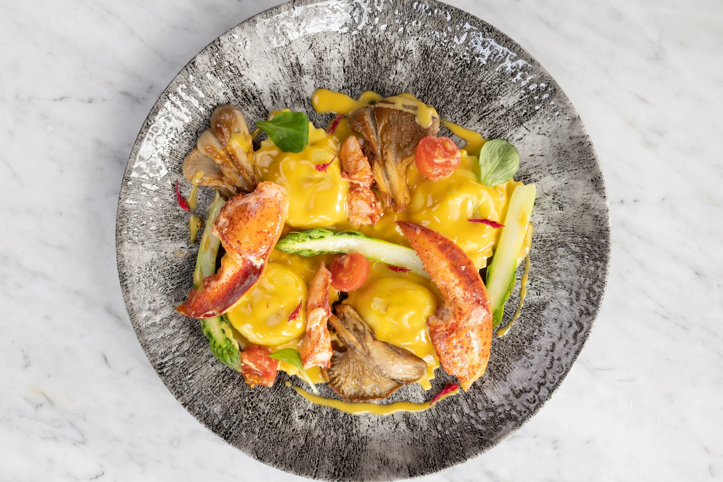 LOBSTER AGNOLOTTI, ricotta, spring vegetables, sherry cream