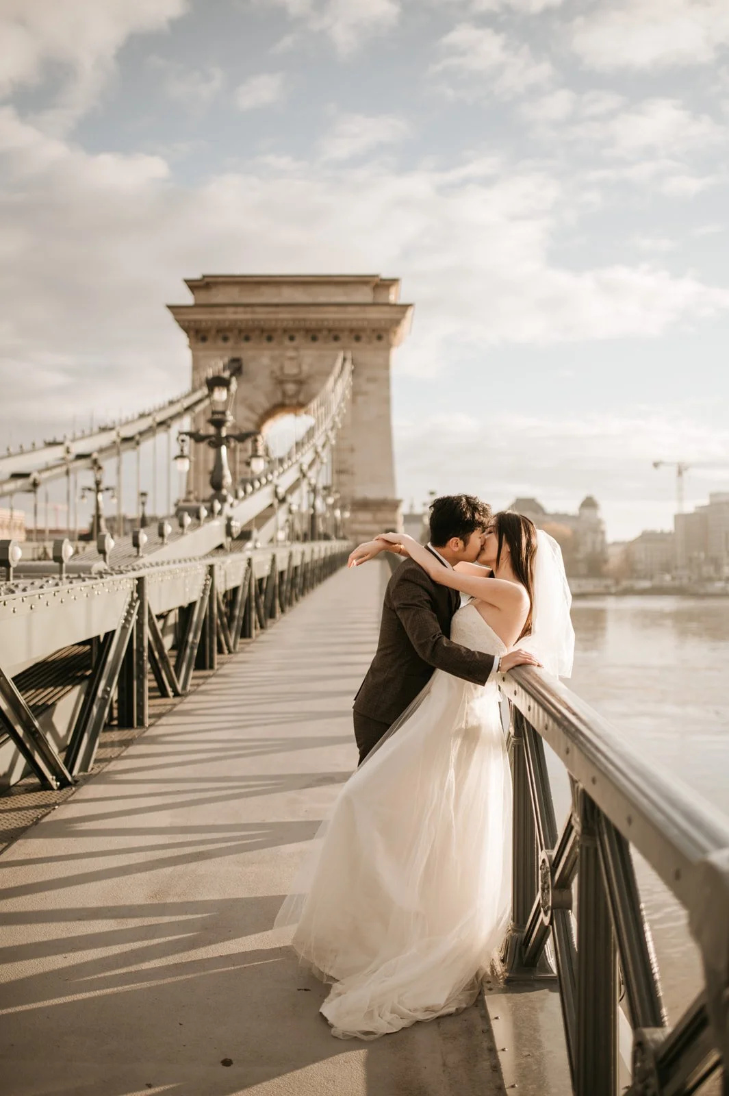 Wedding photoshoot at Chain Bridge in Budapest during a quiet moment