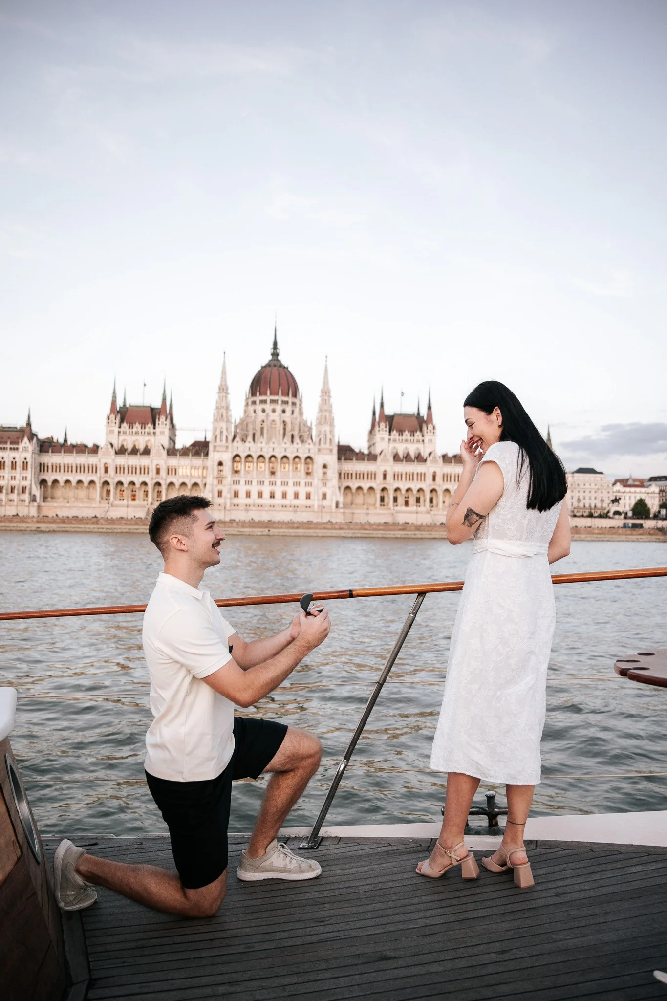 Romantic surprise marriage proposal in Budapest during a sunset