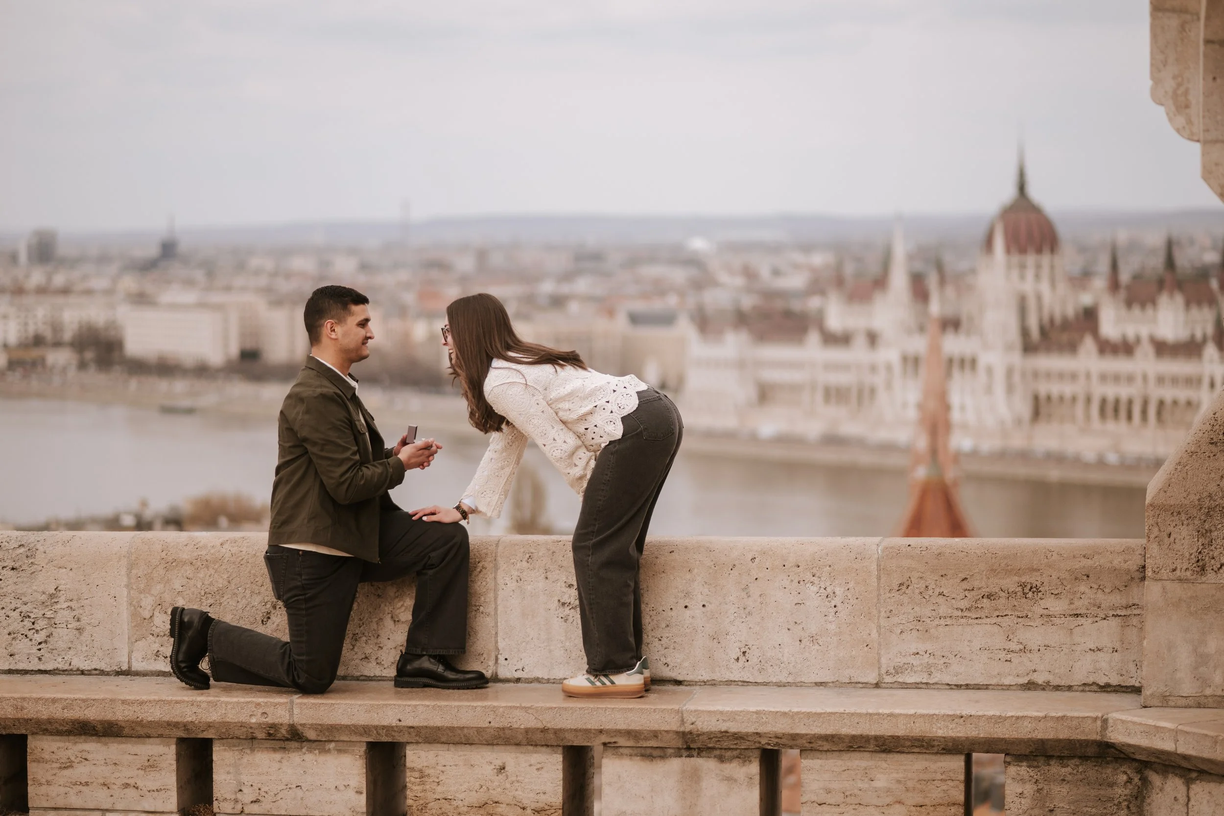 Joyful engagement reaction after a proposal at Fisherman's Bastion Budapest