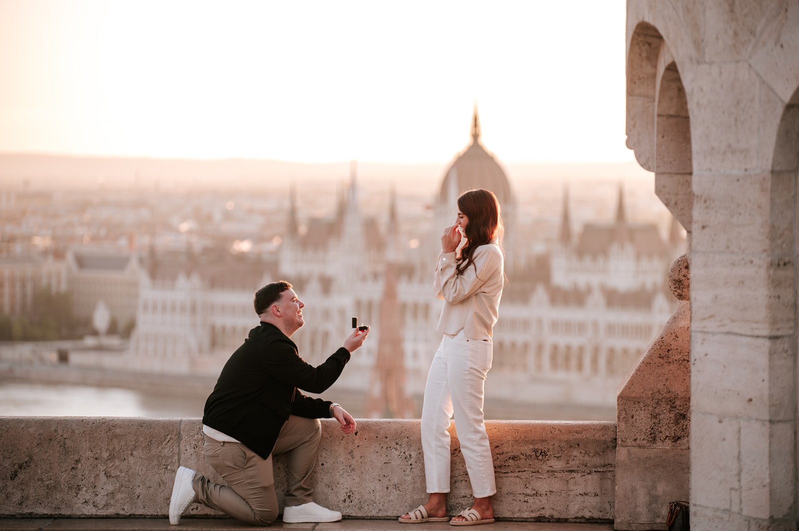 proposing at sunrise at Fisherman’s Bastion with the Budapest Parliament in the background