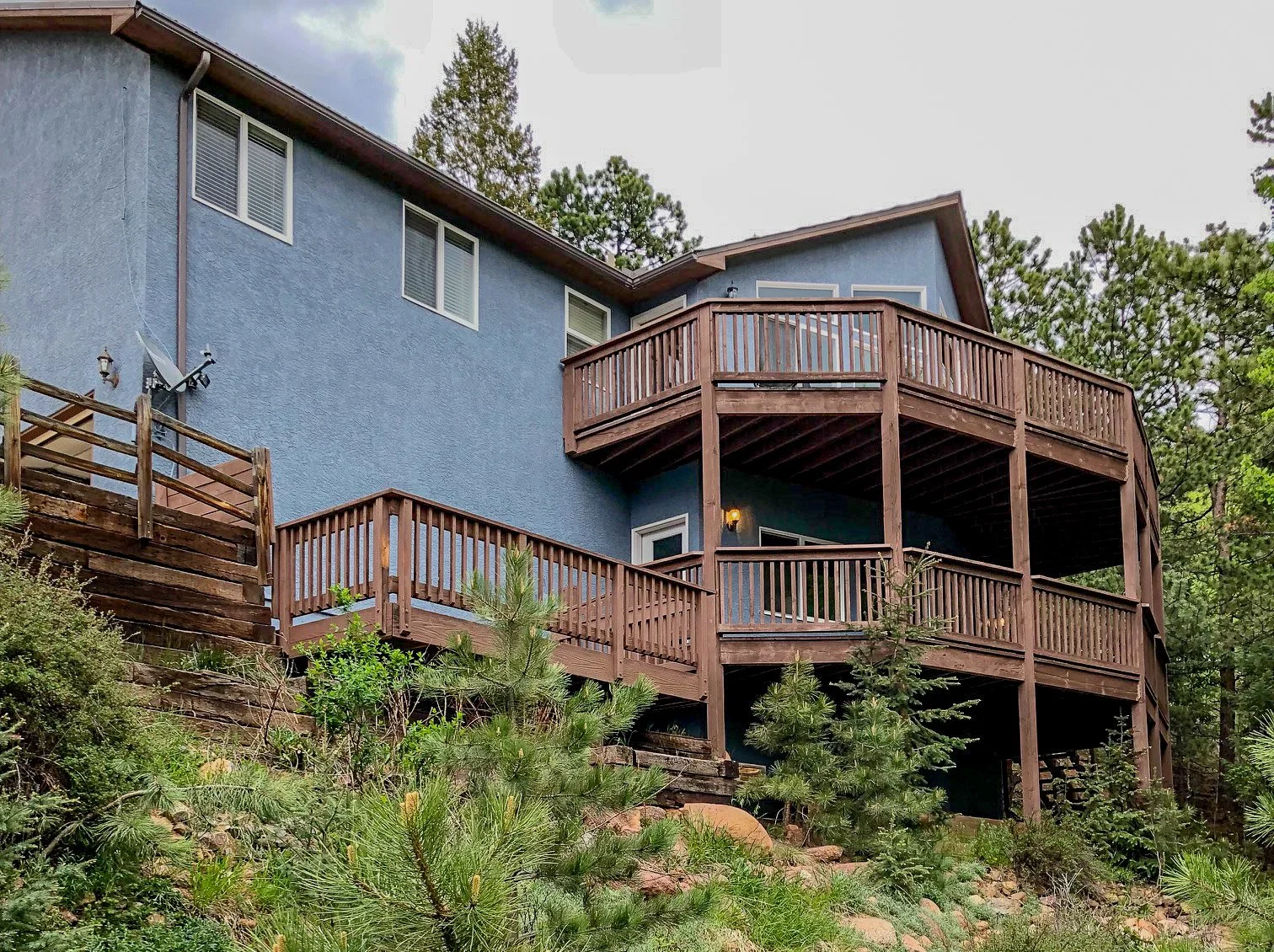 Exterior: After house painted and decks stained.