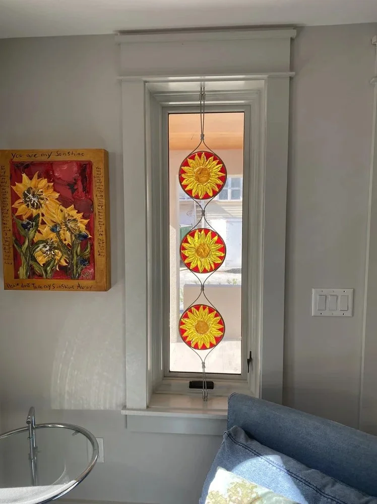 Custom Sunflowers to compliment artwork - 8" in diameter; custom mounted with stainless cables