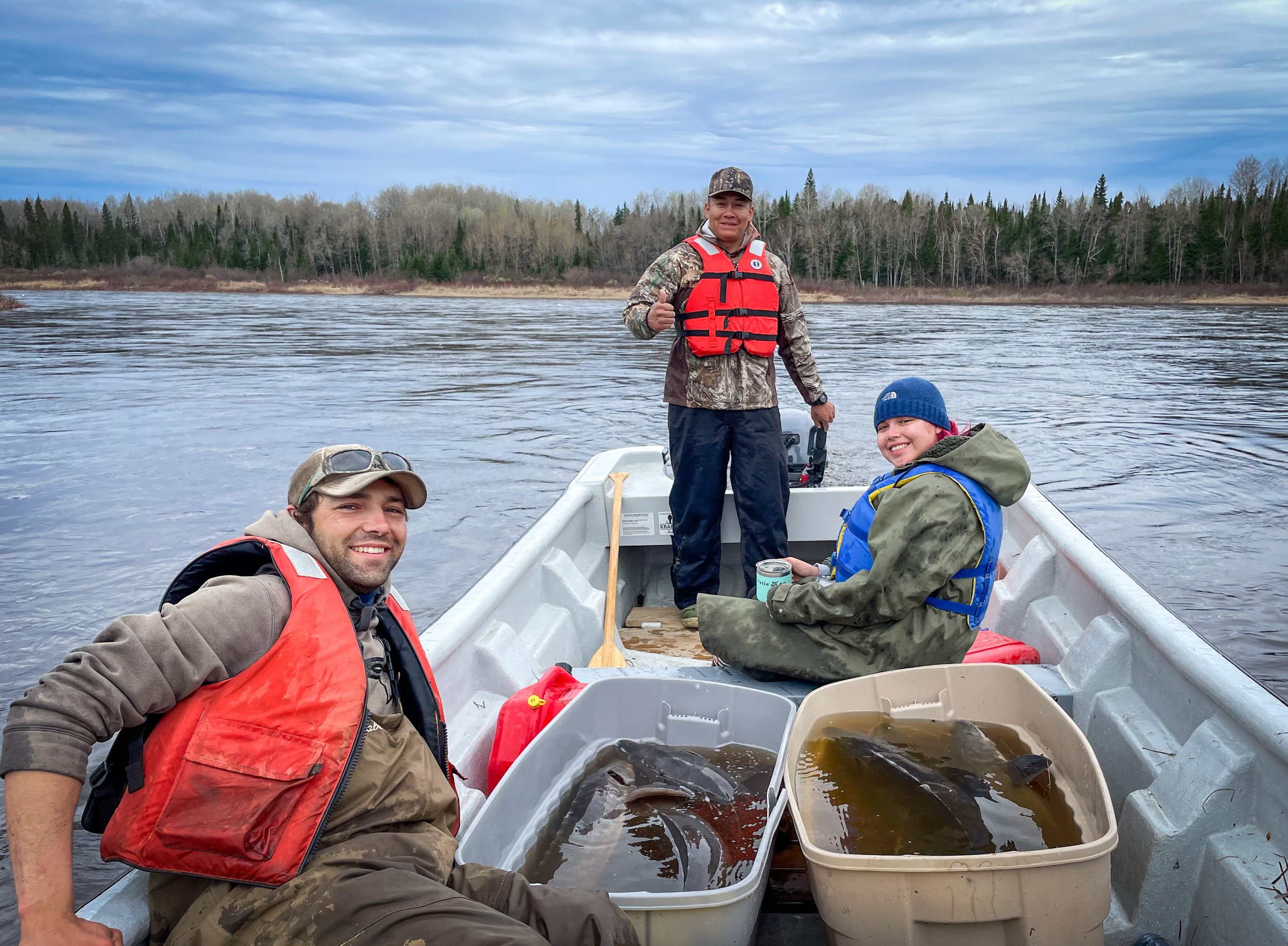 Jacob Seguin (WCS Canada), Ryan Sutherland (Moose Cree First Nation) and Rachel Corston (Moose Cree First Nation youth participant) are happy that they caught so many lake sturgeon! 