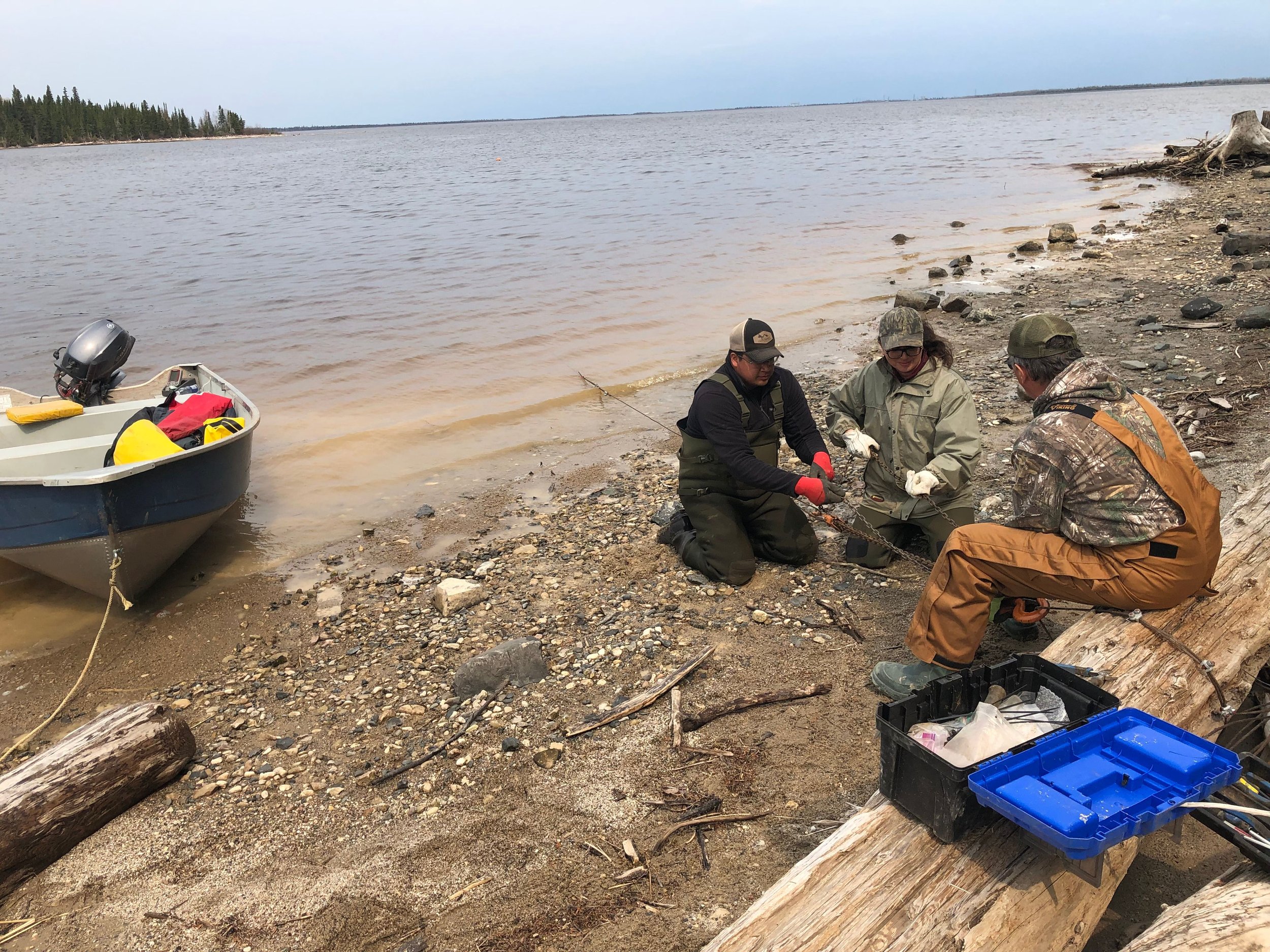 Warren, Jennifer, and Roger prepare a system to haul up a particularly tricky receiver in the Lower Mattagami River