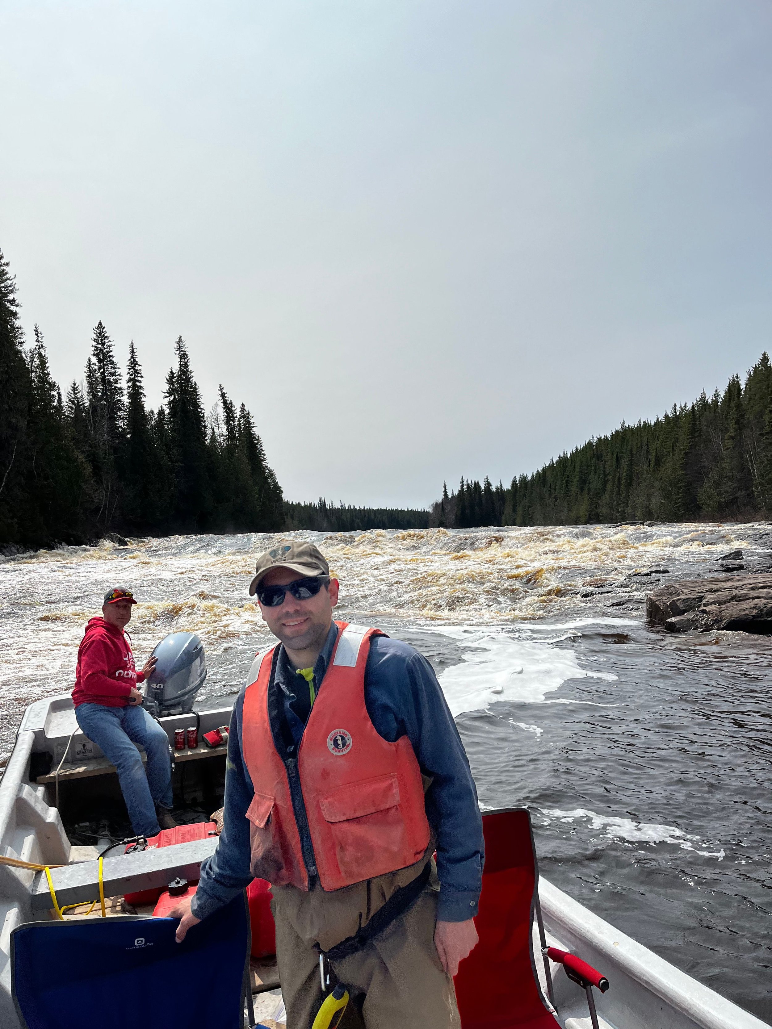 Jacob Seguin (right, WCS Canada) and Phil Sutherland (left, Sutherland Exploration Services) smile for photographer Warren on the North French River