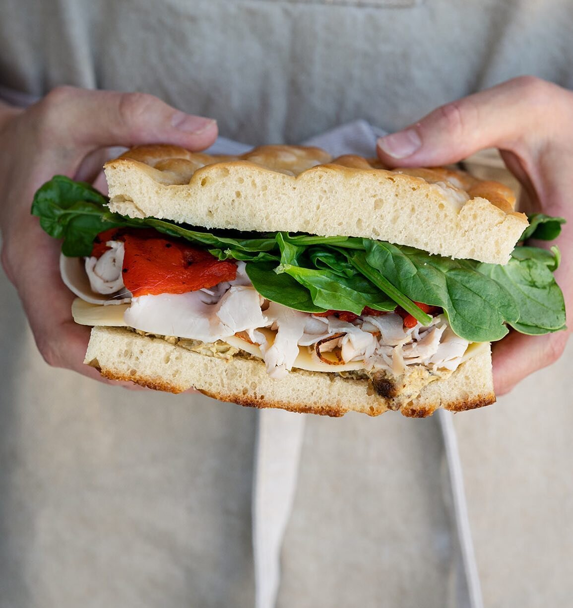 The best selling sandwich of last weekend! Our Turkey Sandwich is loaded with oven roasted turkey, roasted red peppers, havarti, baby spinach, and our Lemony Artichoke Spread. 

Our lemony artichoke spread (also sold separately 😉) was inspired by ou