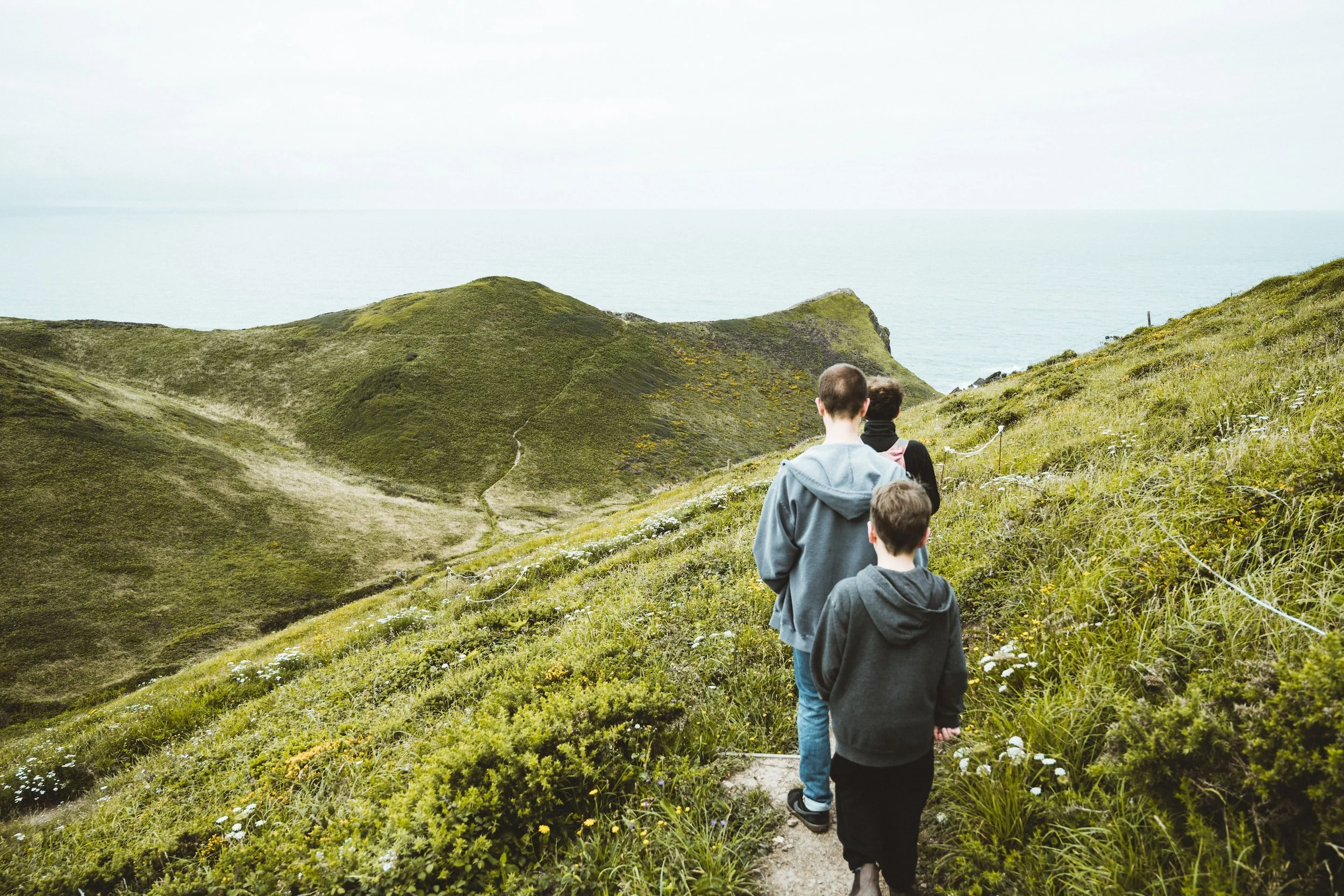 young people following a narrow path symbolizing following Jesus
