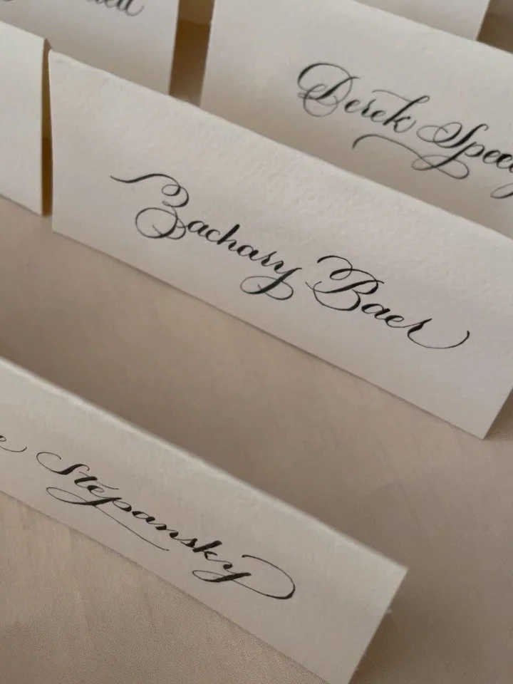 What&rsquo;s more welcoming and valuable to guests than place cards, handwritten in black ink, and elegantly flourished to create absolute magic? ✨

Nothing. The answer is nothing. Send me a DM and let&rsquo;s create some magic together. 🤝

#losange