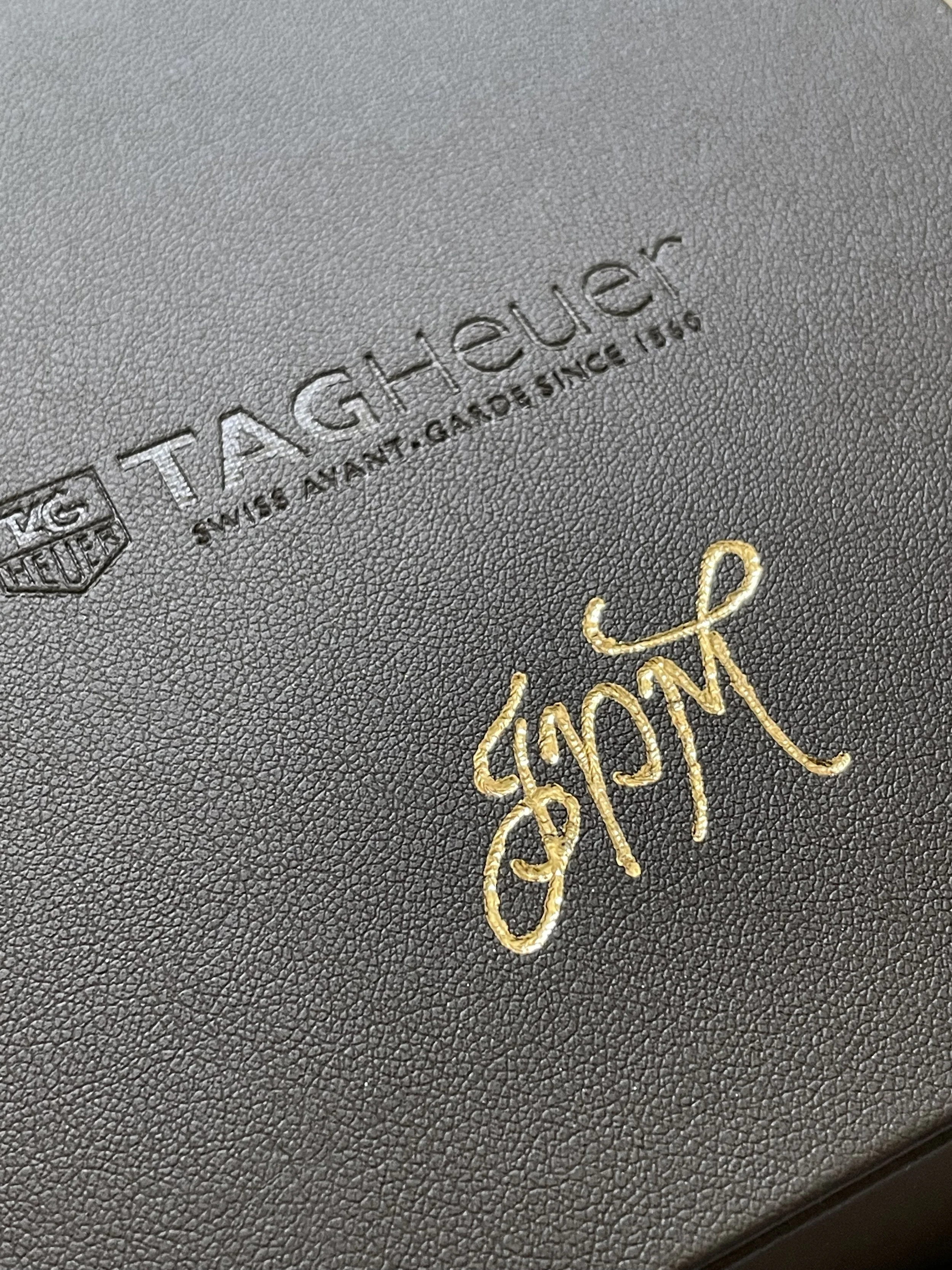 On-site leather monogramming and hot foiling for corporate VIP gifting in Los Angeles.