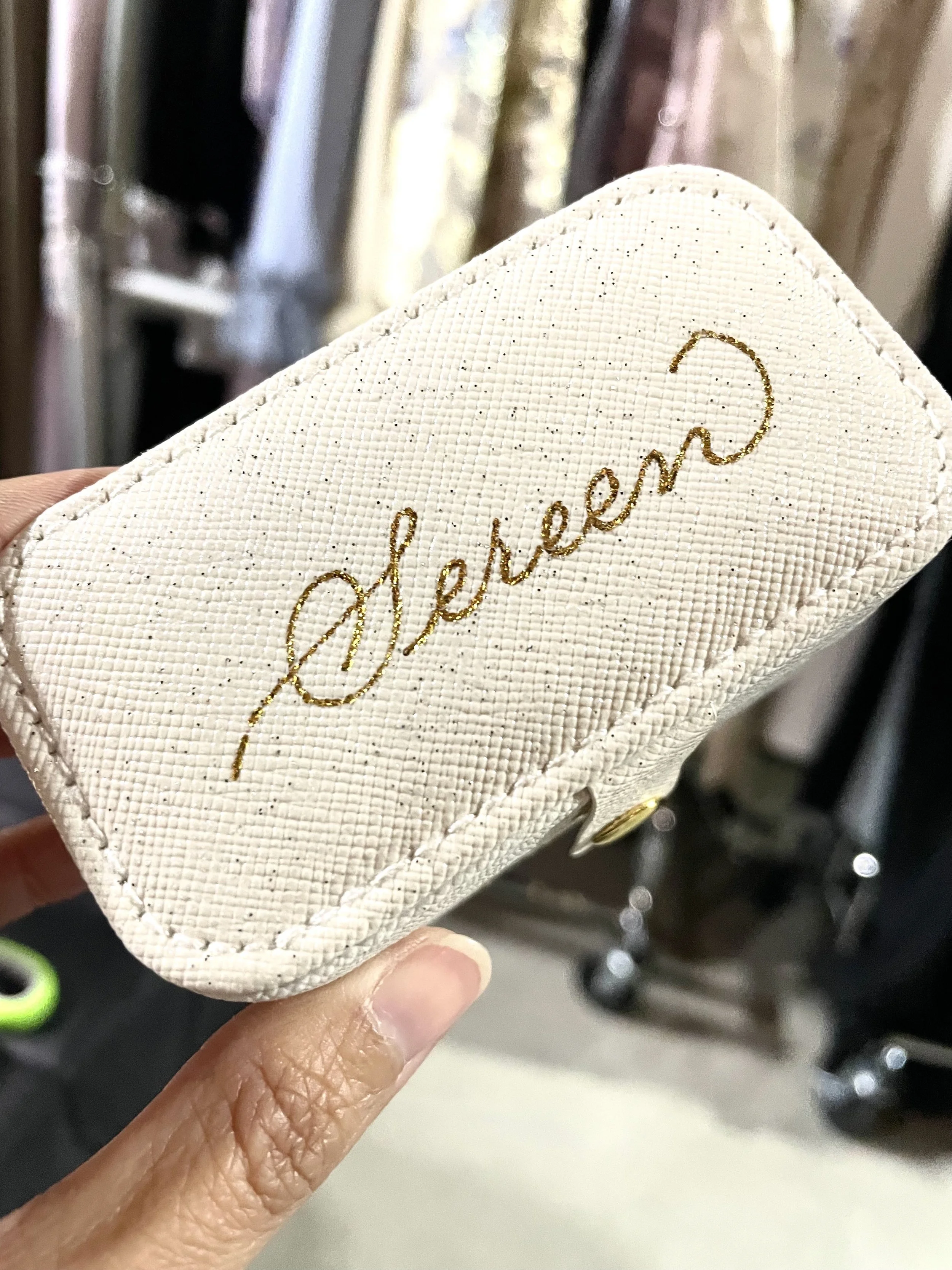 On-site leather monogramming and hot foiling for corporate VIP gifting in Los Angeles.