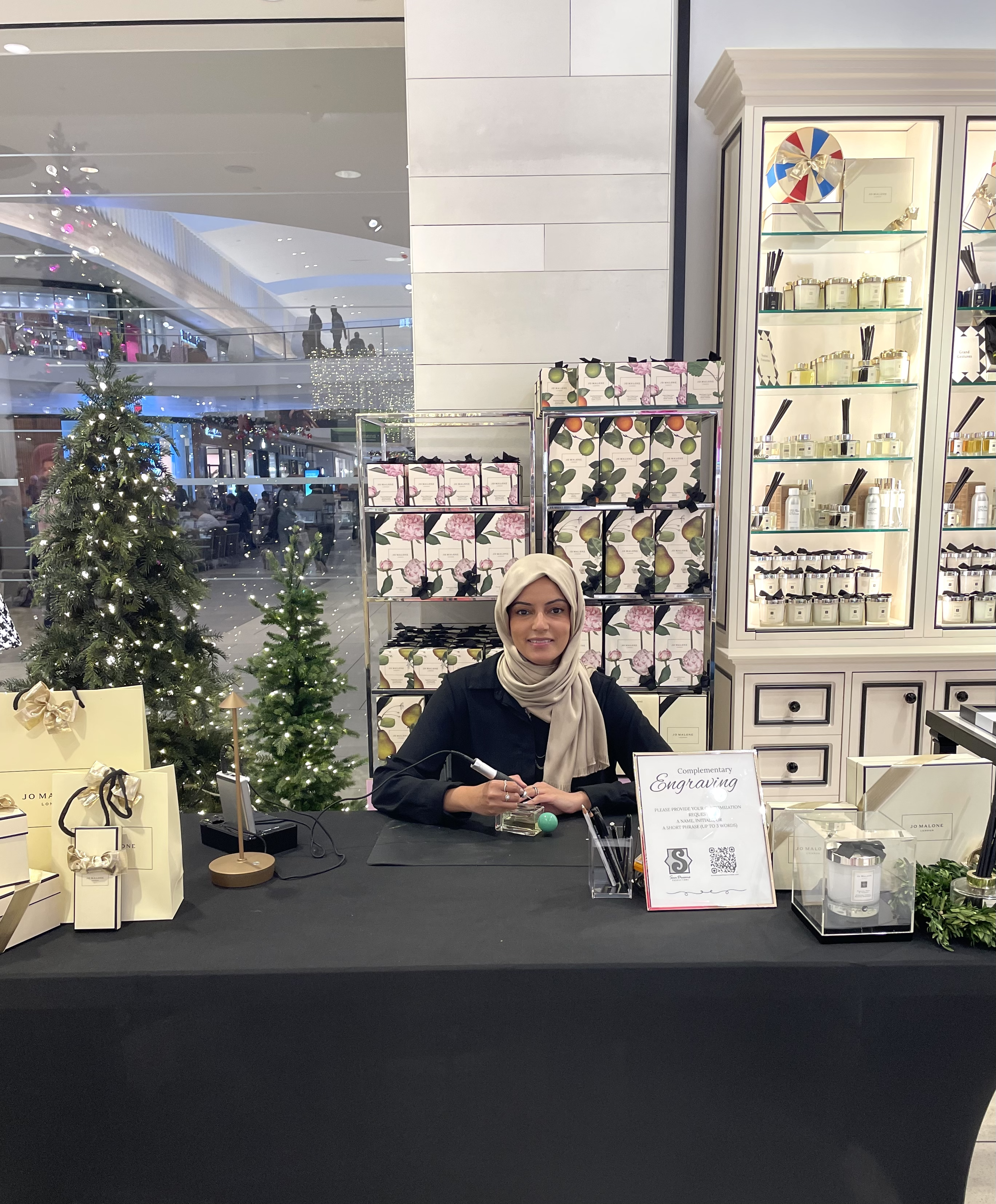 Samina Farooqi providing live hand engraving for a luxury brand activation in Los Angeles.