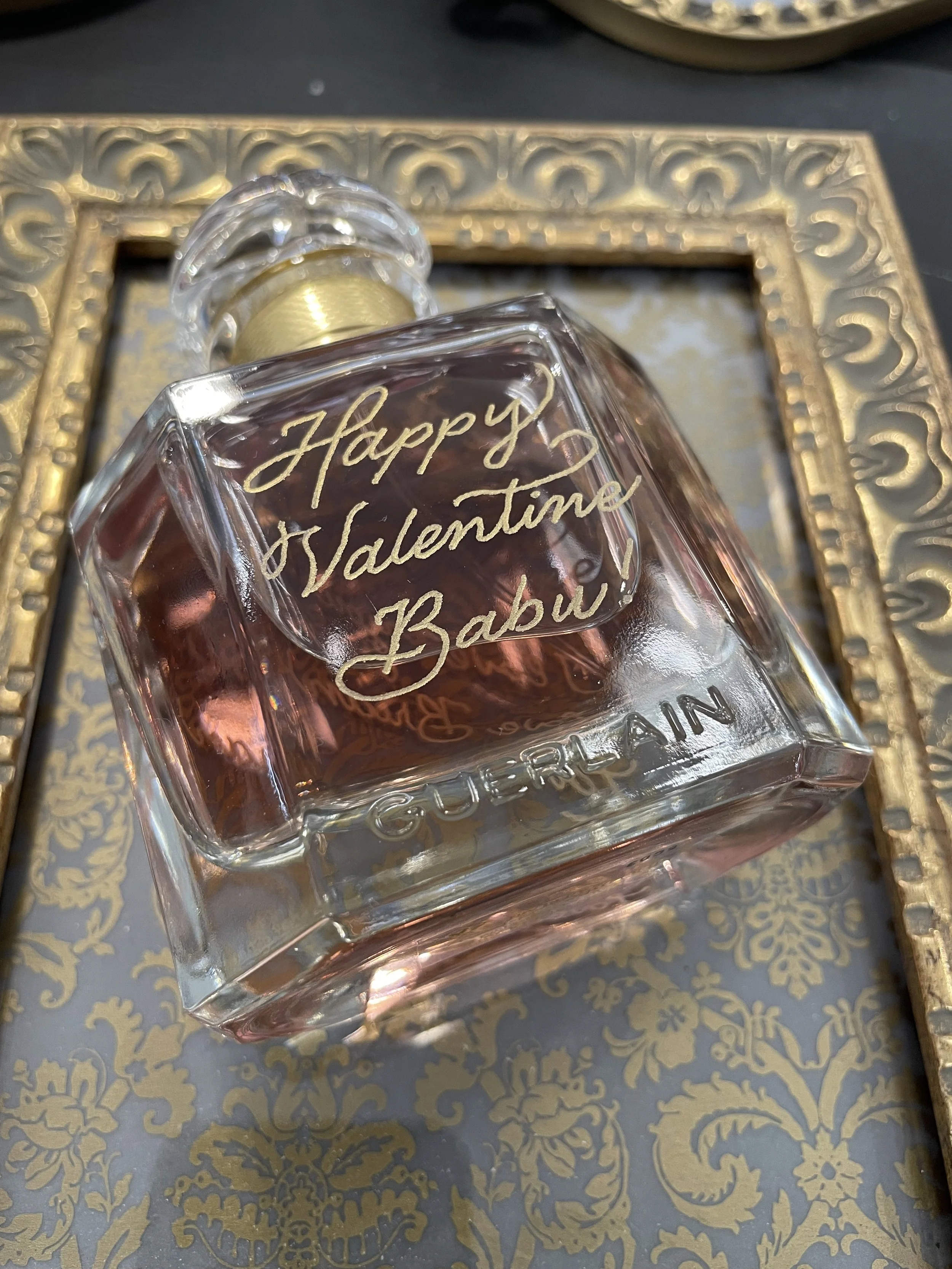 Live perfume bottle engraving service for luxury retail events in Orange County.