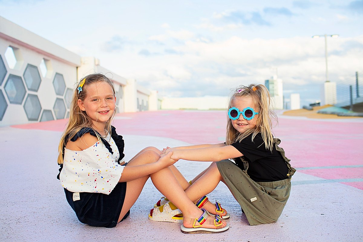 girls criss cross on Miami roof top
