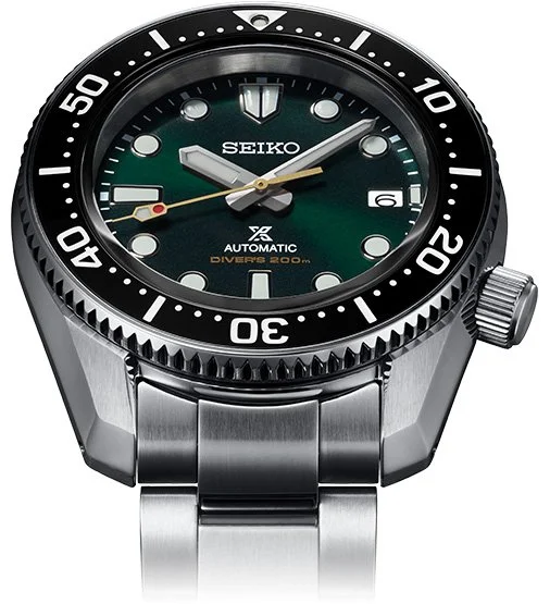 Seiko diver's watch with black bezel, green dial, and stainless steel band.