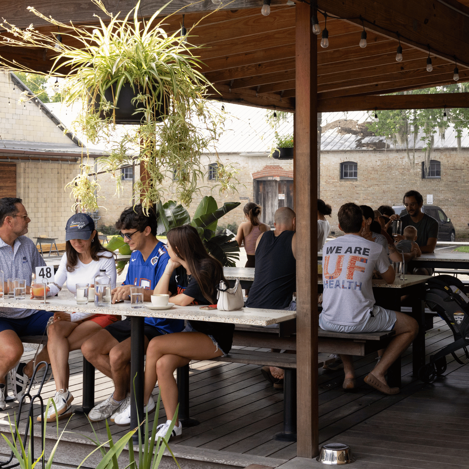 Guests sitting on Humble Wood Fire's covered deck.