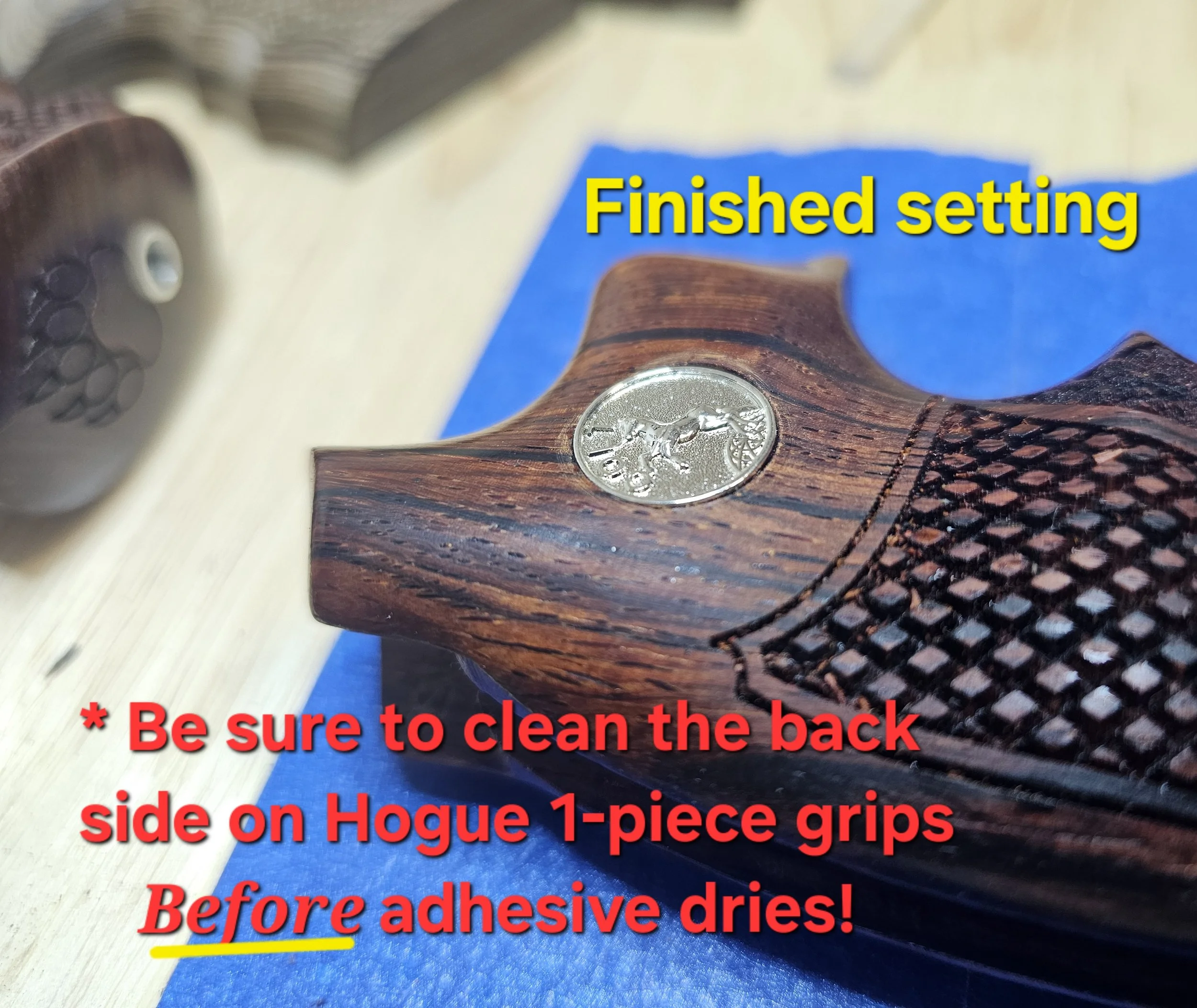 Close-up of a wooden-handled tool with a silver coin attached, on a blue surface with a paper underneath. The image contains overlaid red and yellow text instructing to ensure the back is clean and to be careful about adhesives drying.