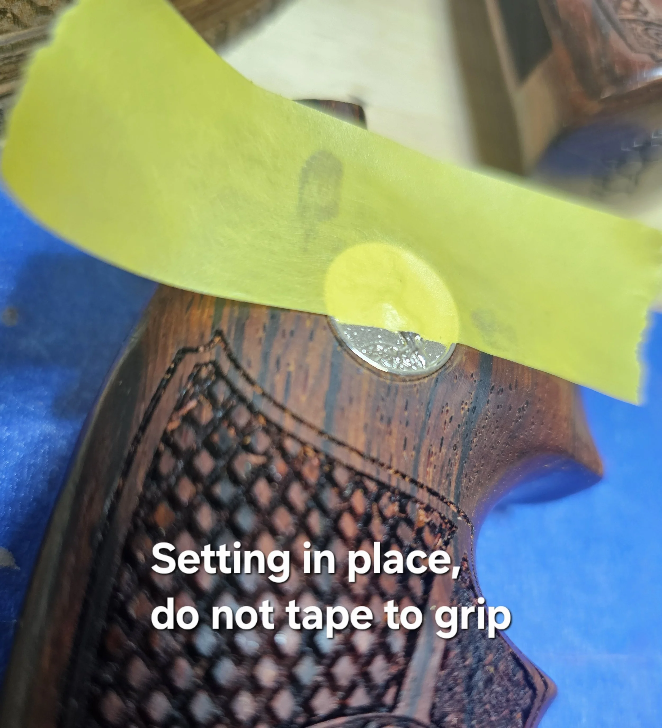 Close-up of dental impression tray with a green noting card and text overlay reading, 'Setting in place, do not tape to grip'.