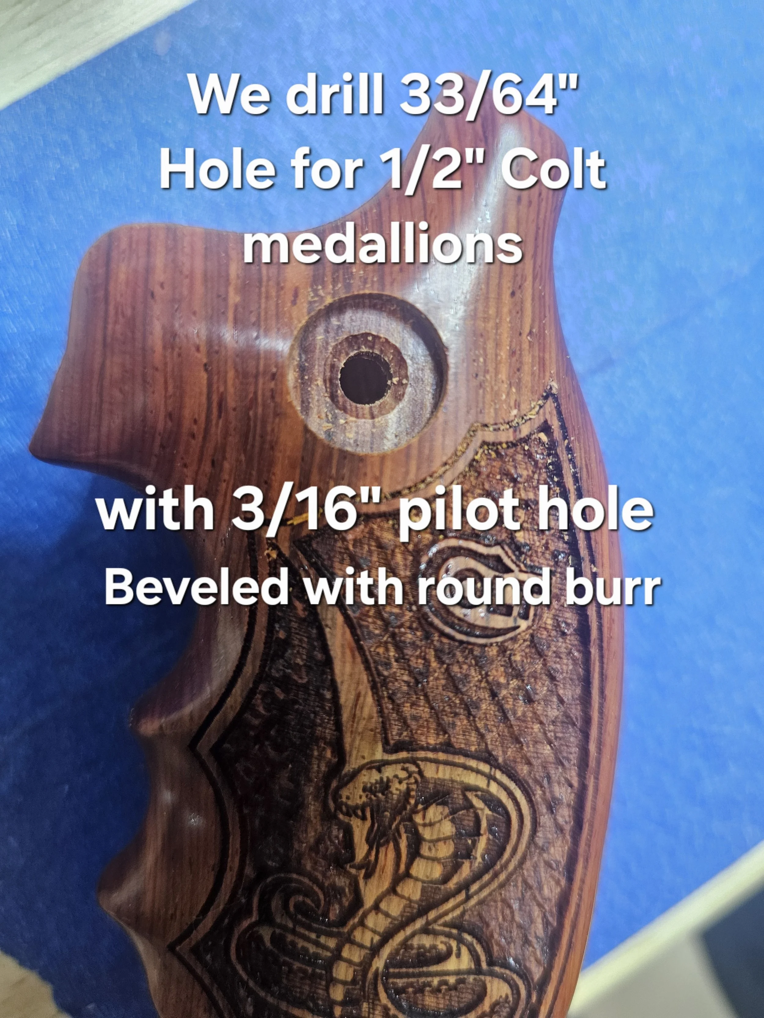 Close-up of a wooden rifle stock with a decorative carved design and a drilled hole for a 1/2 inch collet medallion, on a blue background.