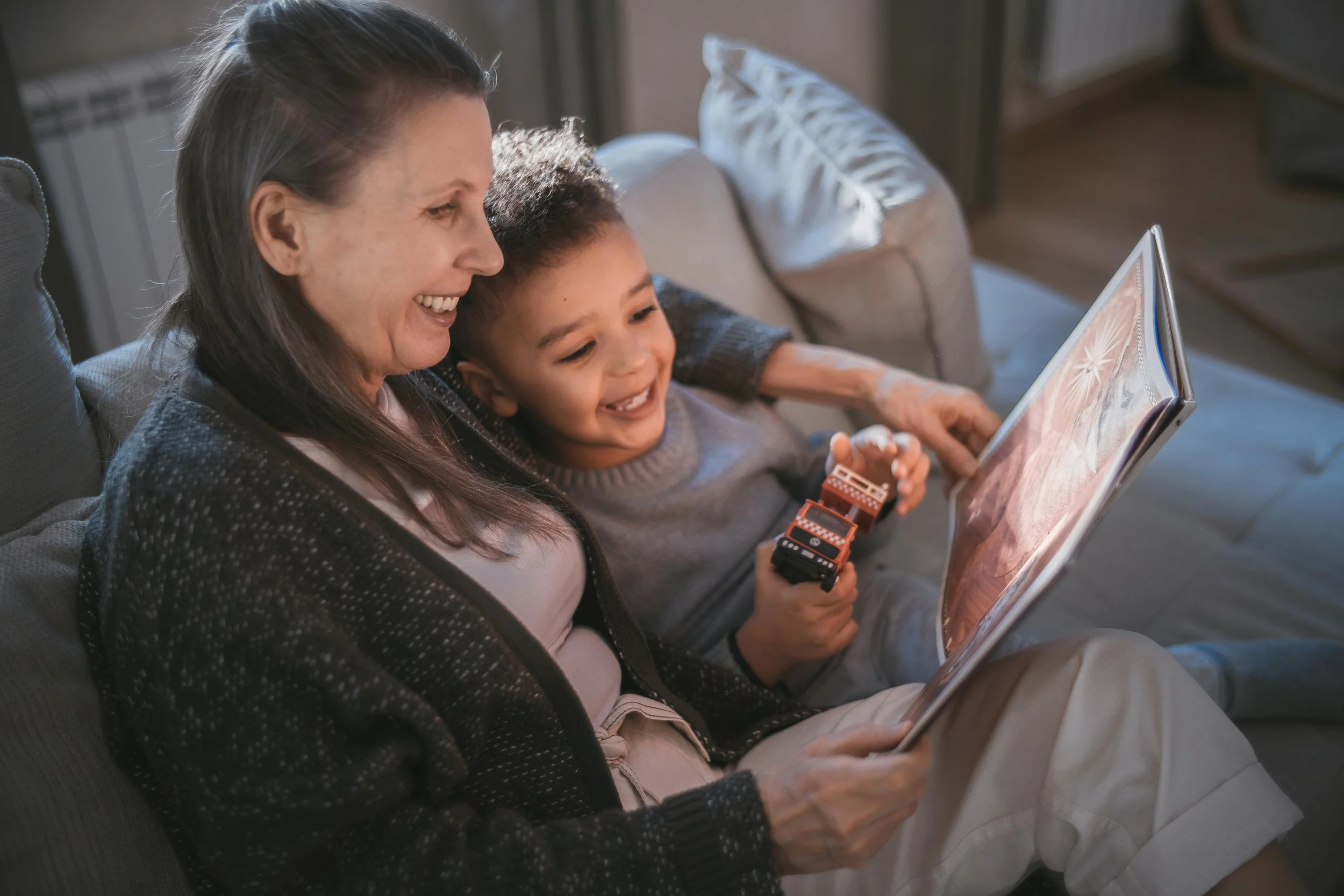 Parent reading a book with a child