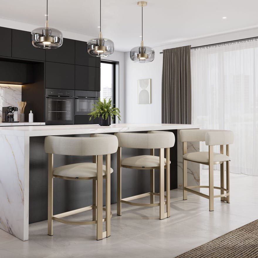 Modern kitchen with black cabinets, marble island, white bar stools, pendant lighting, a potted plant, framed abstract art, sheer white curtains, and a gray curtain on a window.
