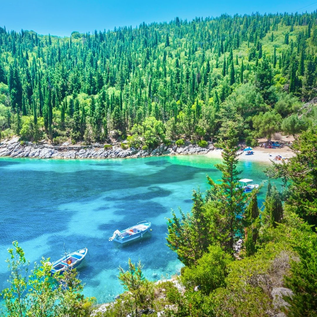 Although the air was still beneath the cypress trees, it was cooler than where they&rsquo;d parked on the dusty road. The path to Dafnoudi beach meandered beneath tall and slender trees, curving down the forested hillside. Sounds were dampened beneat