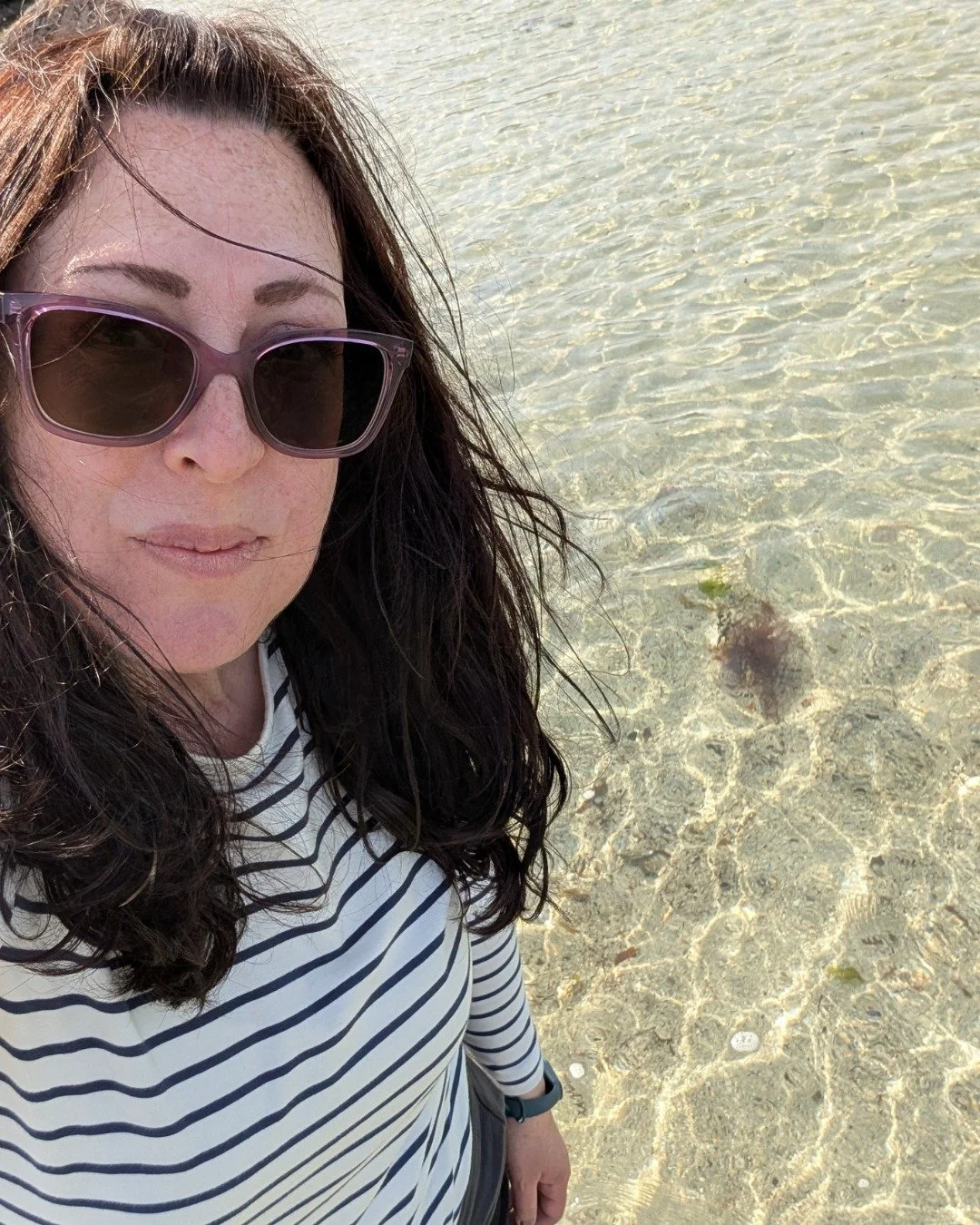 Tilly loved the dramatic landscape with the mountain disappearing into the clustering clouds. They hadn&rsquo;t gone far before Tilly stopped, herding sheep out of the way as she pulled into a parking area. They strolled to the edge of the loch and t