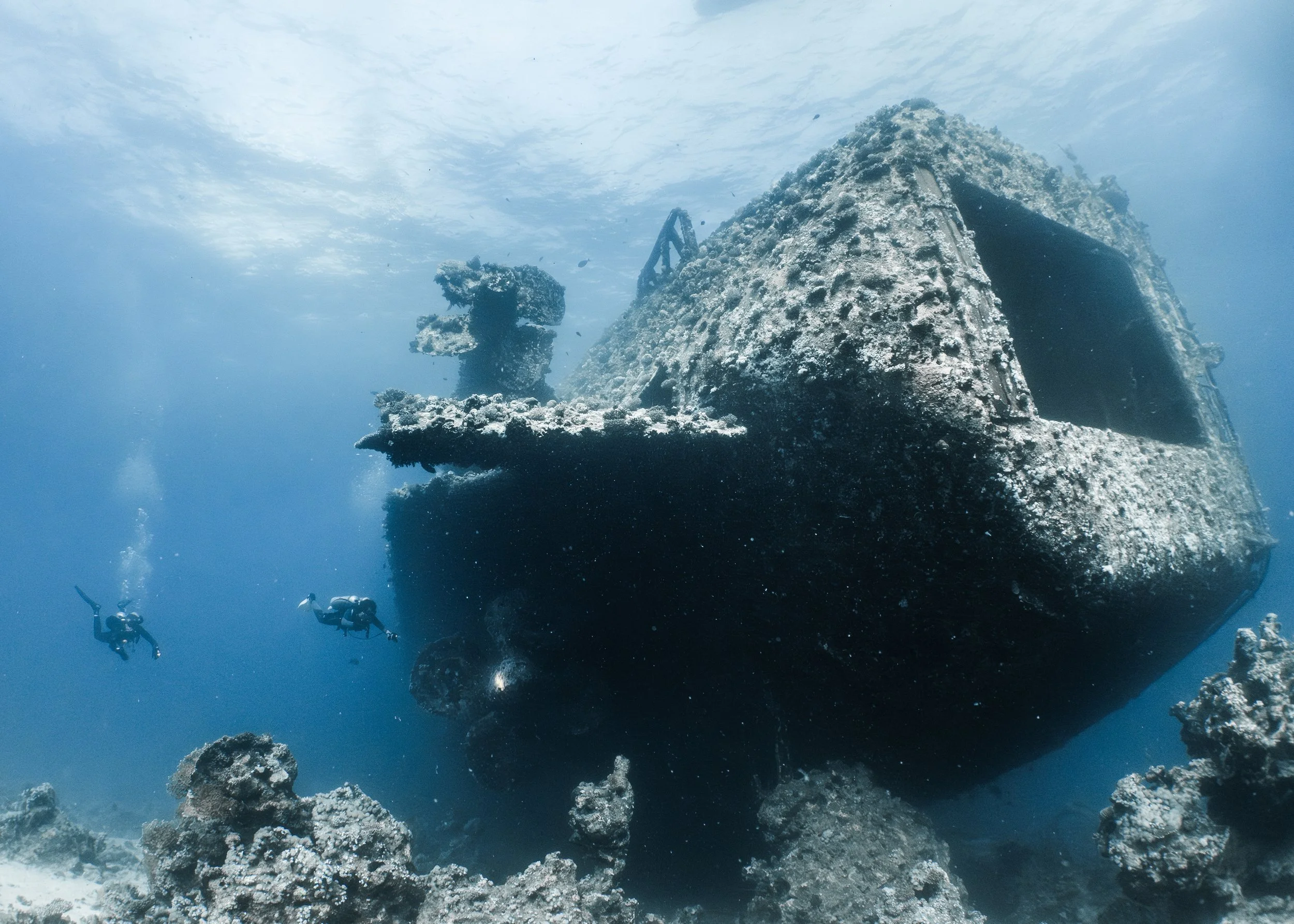 Scuba divers exploring the bow of the Salem Express wreck in the Red Sea, Egypt.