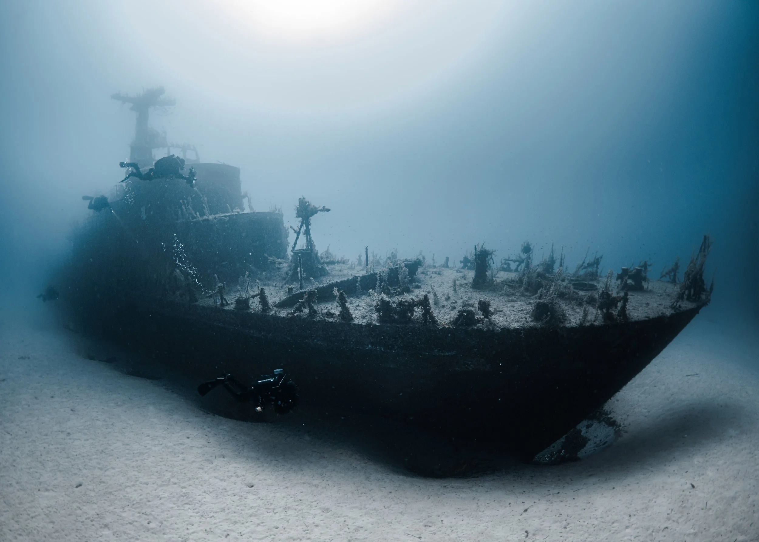 Underwater photograph of the P29 patrol boat wreck resting on the seabed at Cirkewwa, Malta.